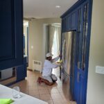 La Clave workers remodeling kitchen