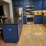Funky eye-catching blue cabinetry in remodeled kitchen