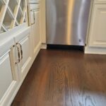 Refinished floors, refinished cabinets in kitchen