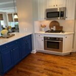 Royal Blue cabinetry and white cabinetry in modern kitchen with stainless steel appliances done by Laclave Home improvement