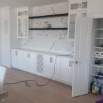 White cabinets with white marble backsplash