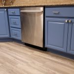 Modern Indigo cabinetry with brass fixtures