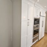 White Modern cabinetry in remodeled kitchen