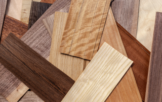 different types of hardwood flooring samples scattered across the floor