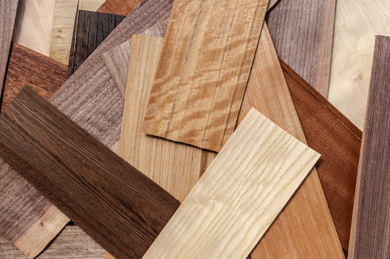 different types of hardwood flooring samples scattered across the floor